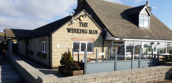 Outside The Winking Man
